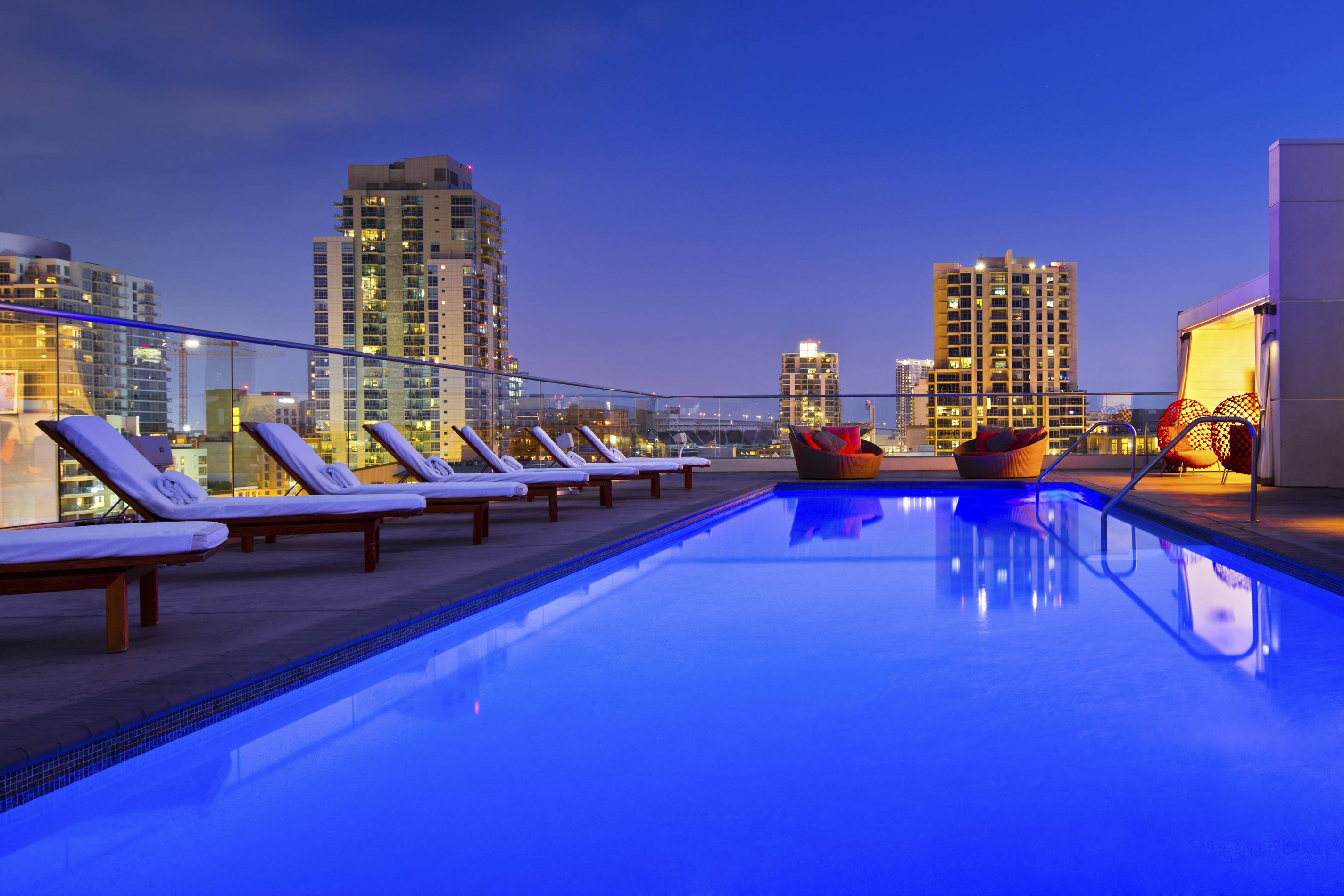 rooftop pool glows at night