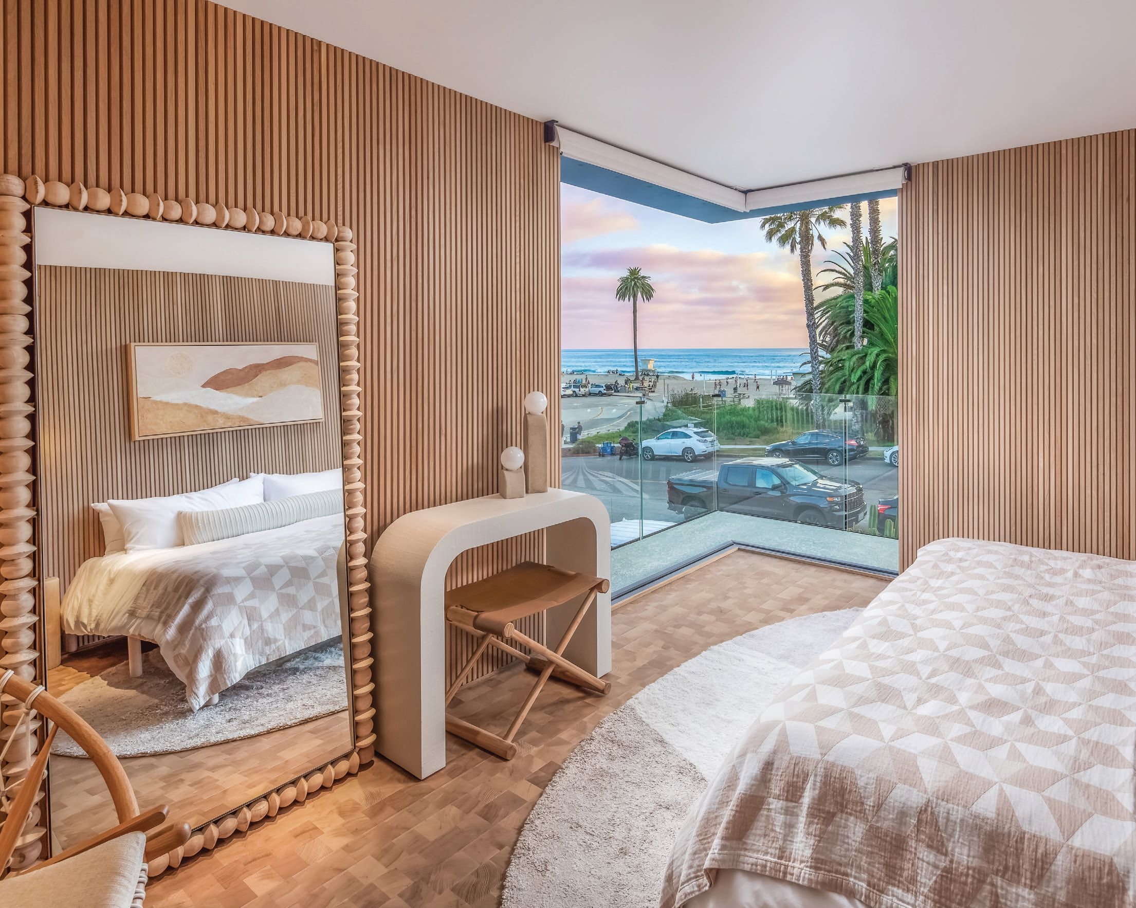 Disappearing walls offer owners prime views of Moonlight Beach from the primary bedroom. PHOTO BY SAM CHEN/ALOHA PHOTOGRAPHY