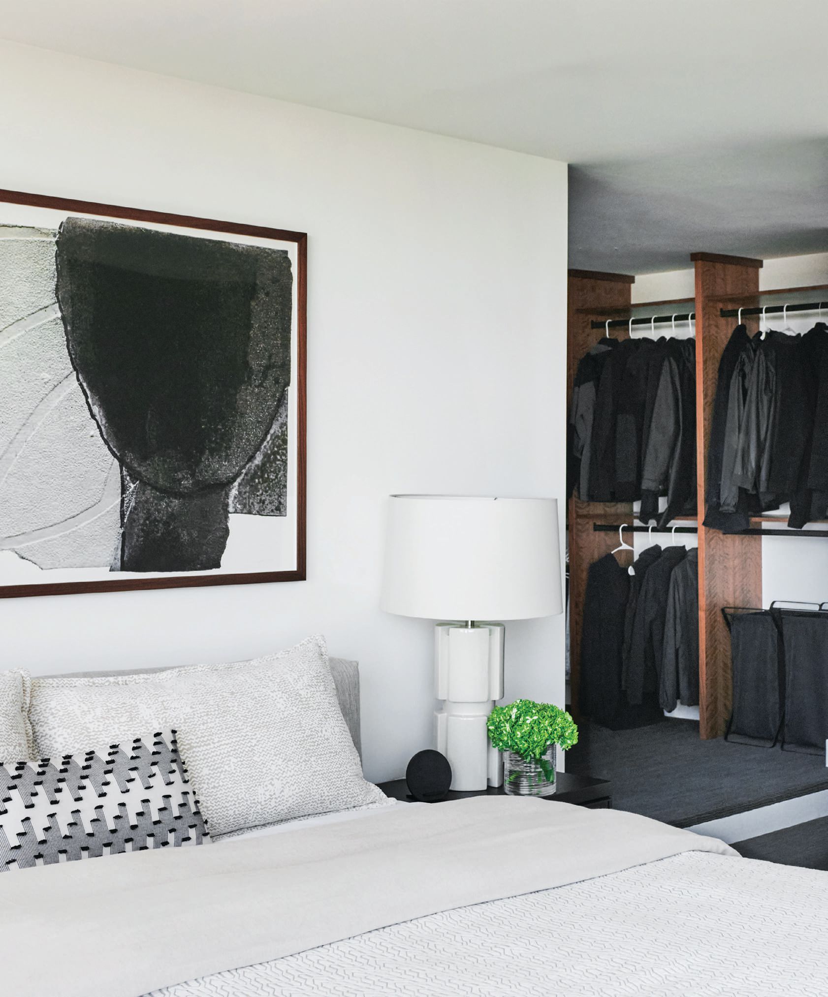 A Camerich bed is flanked by Arteriors lamps in this sleek and simple bedroom. PHOTO COURTESY OF BRIAN BROWN STUDIOS
