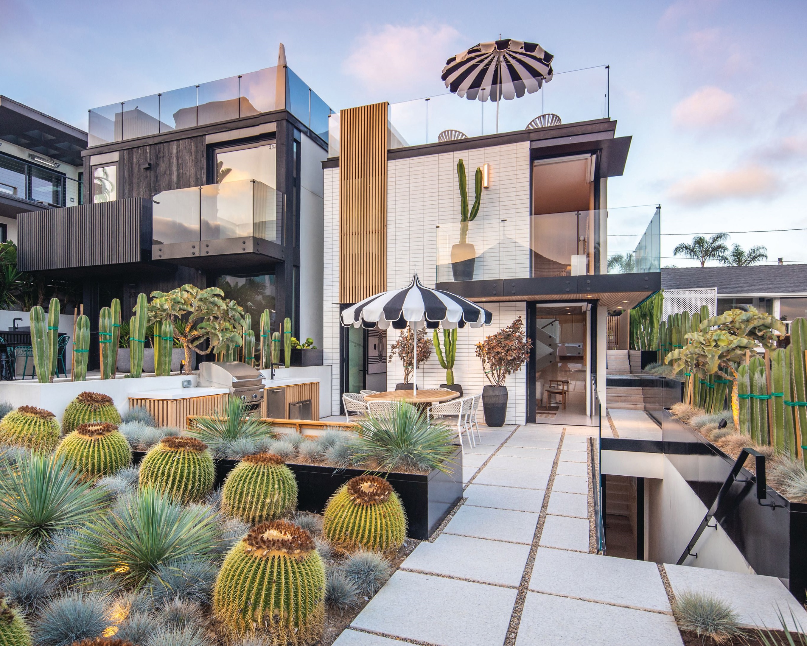 Desert-inspired landscaping and sleek outdoor spaces gives this three-story saltbox plenty of curb appeal. PHOTO BY SAM CHEN/ALOHA PHOTOGRAPHY