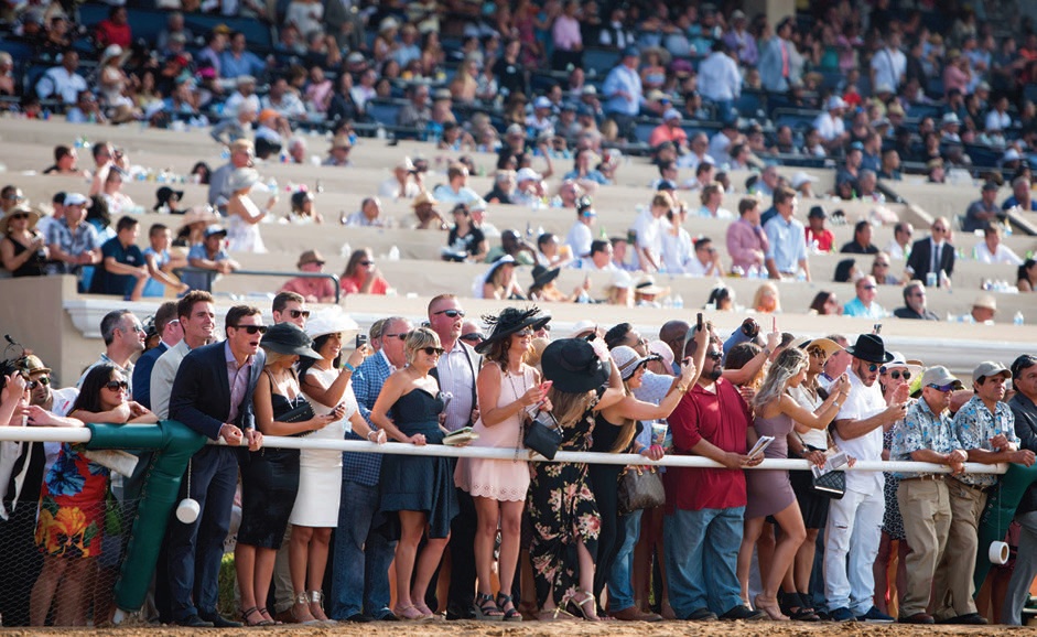 Well-heeled fans in high spirits. PHOTO COURTESY OF DEL MAR THOROUGHBRED CLUB