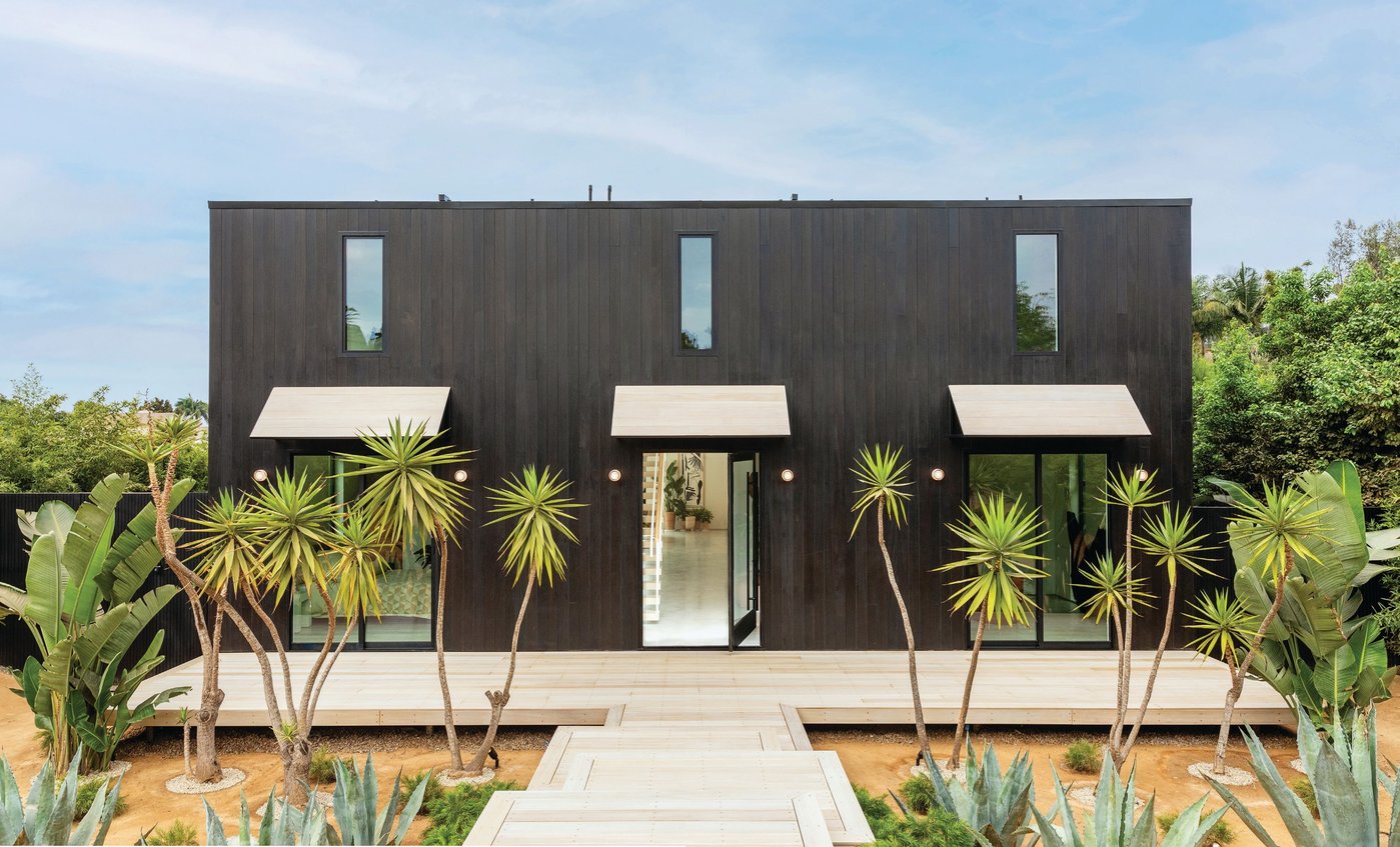 Desert-inspired landscaping and a sleek matte black exterior greet guests at the curb. PHOTOGRAPHED BY JENNY SIEGWART
