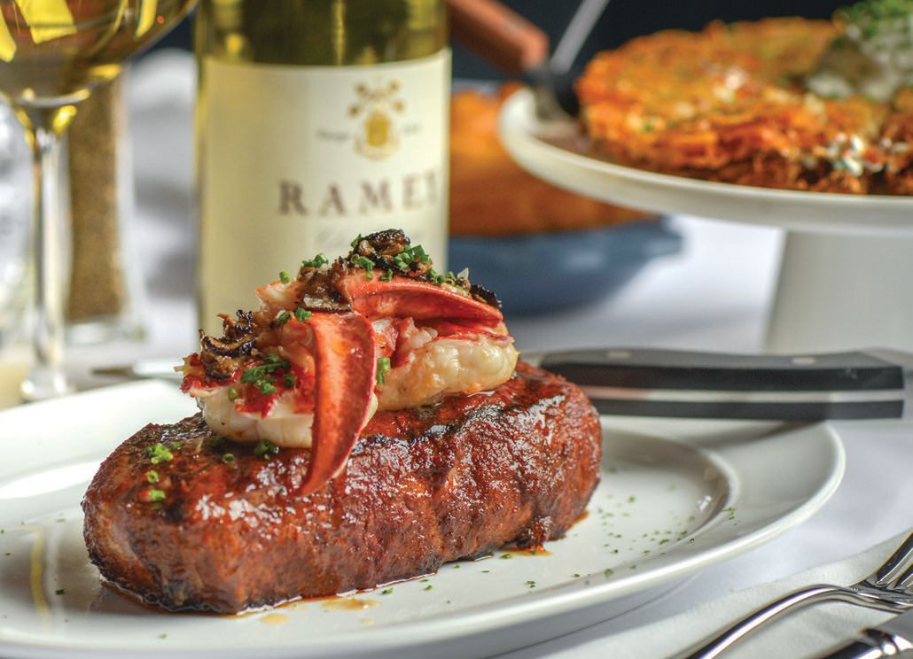 Patrons can top any of Steak 48’s prime cuts with black truffle-sauteed Maine lobster, among other decadent toppings. PHOTO BY:  COURTESY OF STEAK 48