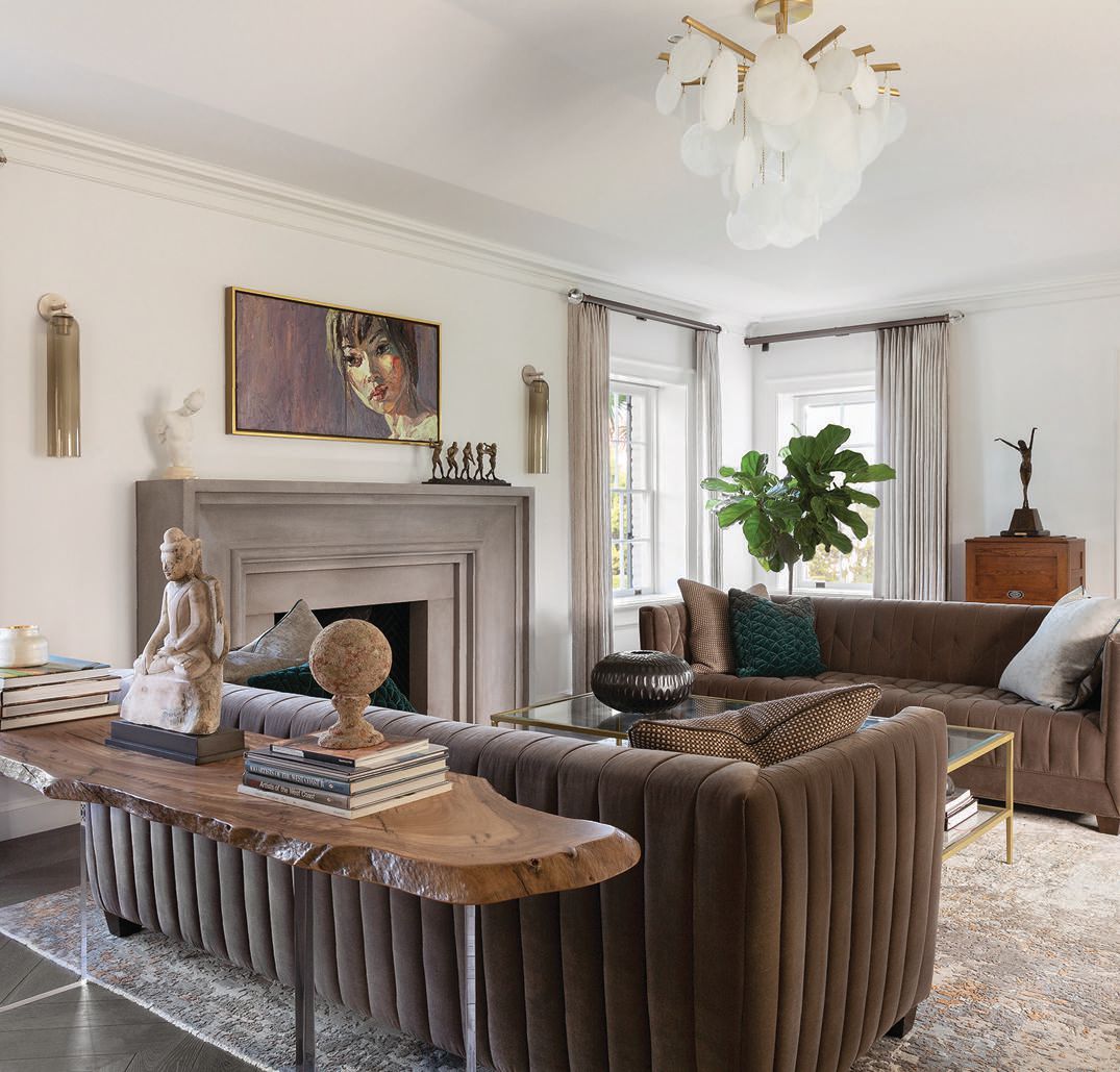 The brown-toned living room features a bespoke console and sofas PHOTO BY LAURA HULL PHOTOGRAPHY